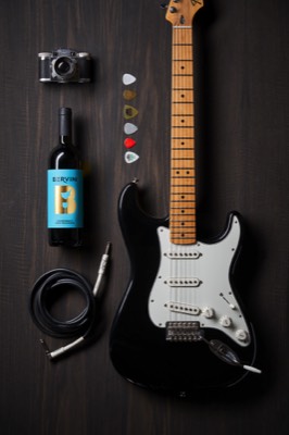  gitar aand music items with wine bottle  