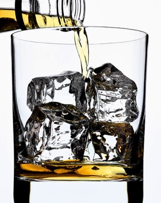  Whiskey being poured over ice 