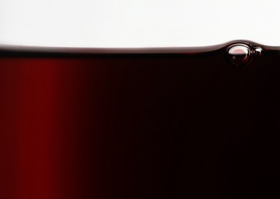  Top of a red wine glass with a bubble  